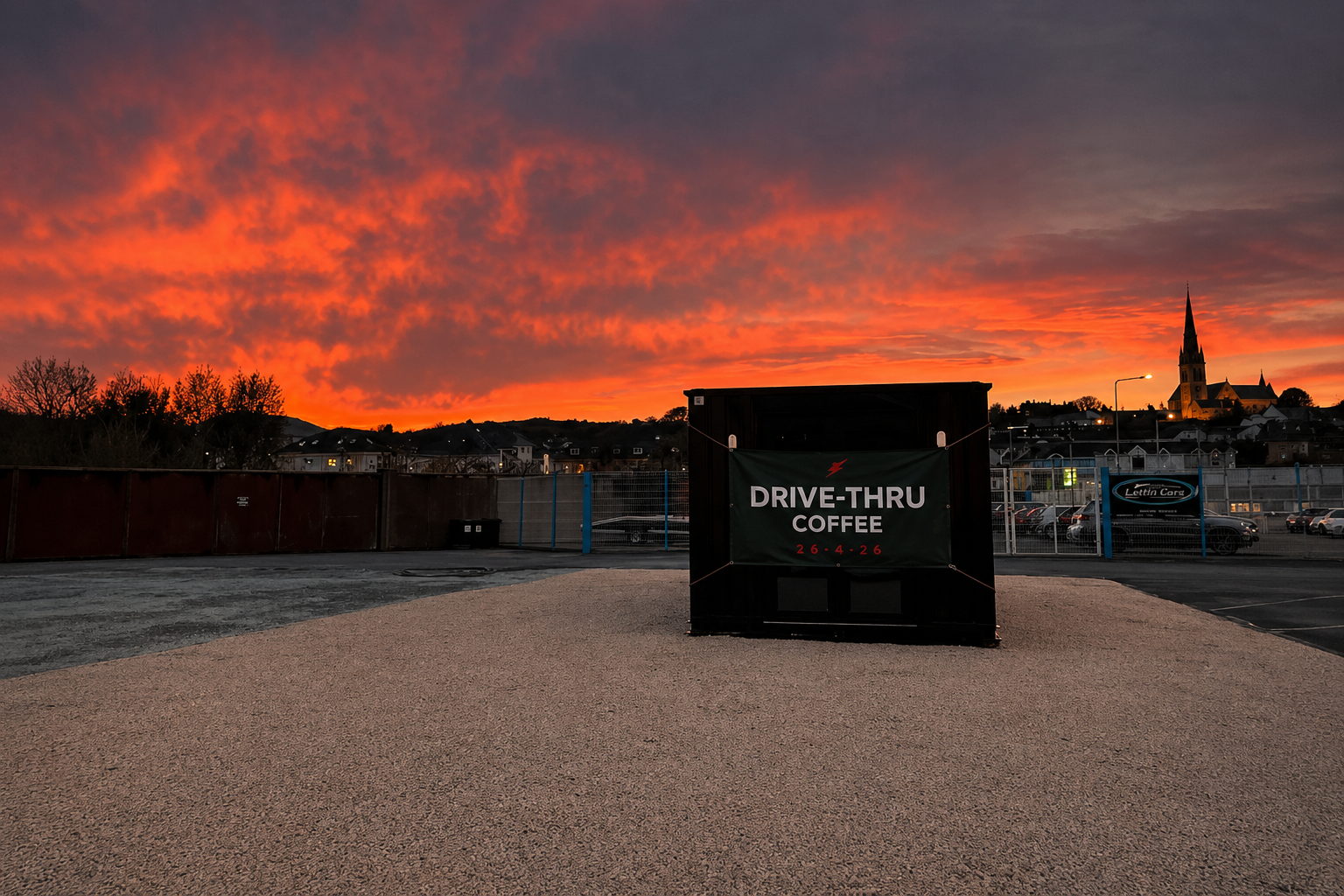 Horsepower Coffee drive-thru kiosk at sunset in Letterkenny under a dramatic red sky.